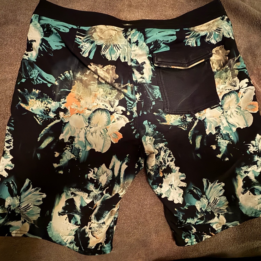 O’Neill Hyperfreak multi color flower print bathing suit. Size 33